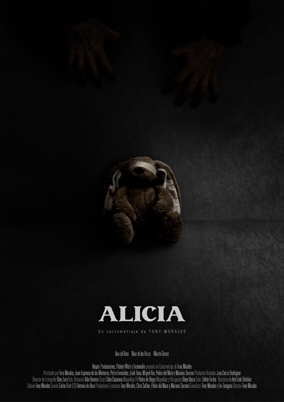 A poster for the film Alicia. It shows a teddy bear sitting against a wall with dark hands reaching towards it.