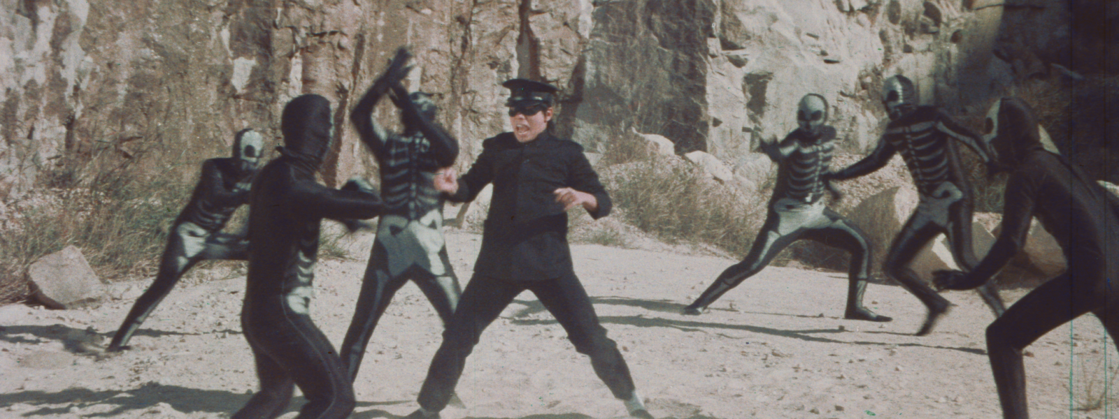 Bruce Lee clone fights skeletons with kung fu
