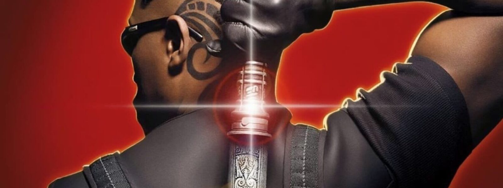 Blade poster. Man unsheathing sword from behind back.