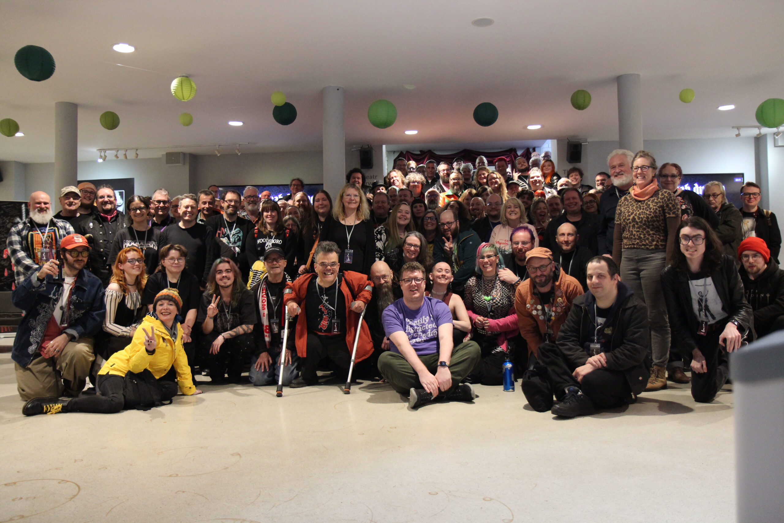 A large group of people - the Abertoir audience - are gathered together posting for a group photo.